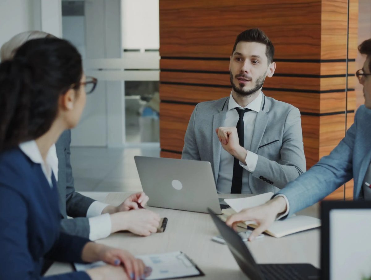 Fountain team members supporting a client together